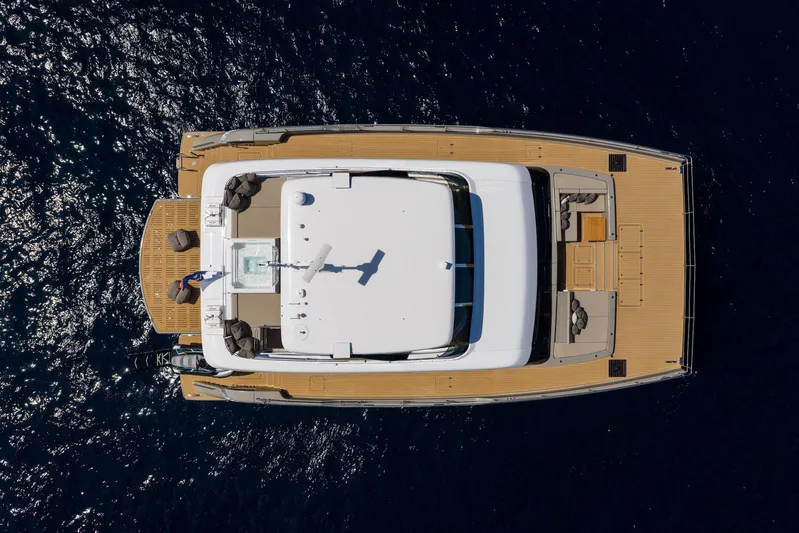 Vahewa Yacht Photos Pics Aerial view of 2024 Sunreef Power Cat yacht on deep blue water.