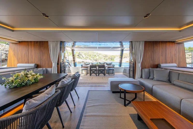 Vahewa Yacht Photos Pics Luxurious interior of 2024 Sunreef Power Cat yacht with elegant seating and dining area.