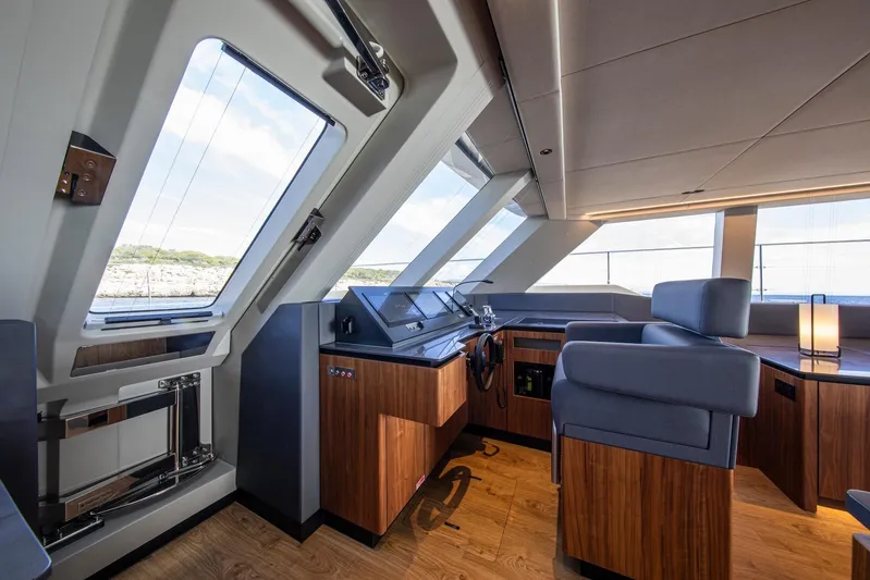 Vahewa Yacht Photos Pics Luxurious interior of 2024 Sunreef Power Cat yacht with modern helm and panoramic windows.