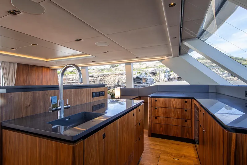 Vahewa Yacht Photos Pics Luxurious kitchen interior of 2024 Sunreef Power Cat yacht with modern wood cabinetry.