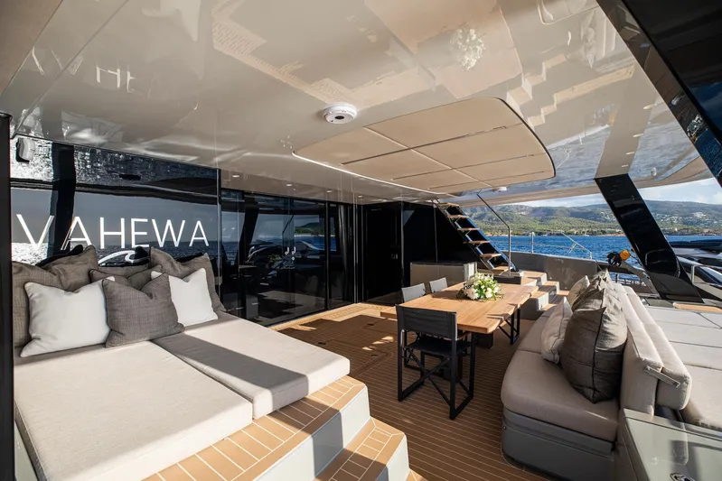 Vahewa Yacht Photos Pics Luxurious 2024 Sunreef Power Cat yacht deck with elegant seating and dining area.