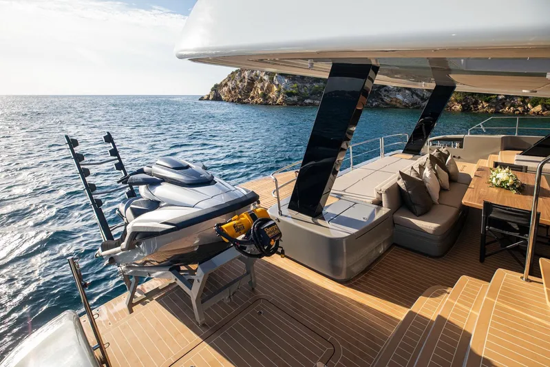 Vahewa Yacht Photos Pics Luxurious 2024 Sunreef Power Cat yacht deck with jet ski, ocean view, and elegant seating area.