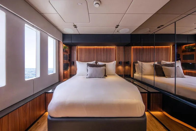 Vahewa Yacht Photos Pics Luxurious bedroom interior of 2024 Sunreef Power Cat yacht with ocean view windows.