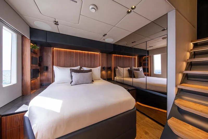 Vahewa Yacht Photos Pics Luxurious bedroom interior of 2024 Sunreef Power Cat yacht with modern design and wooden accents.
