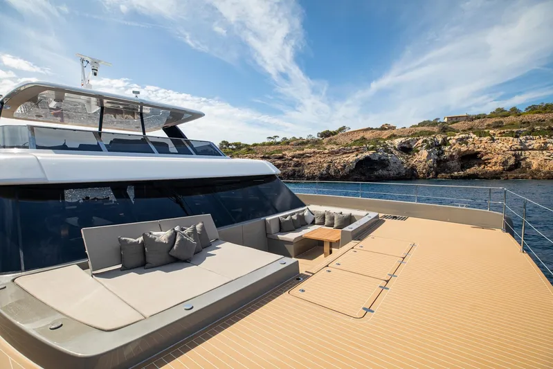 Vahewa Yacht Photos Pics Luxurious 2024 Sunreef Power Cat yacht with spacious deck and scenic coastal view.