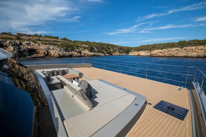 Vahewa Yacht Photos Pics Luxurious 2024 Sunreef Power Cat yacht deck with scenic coastal view.