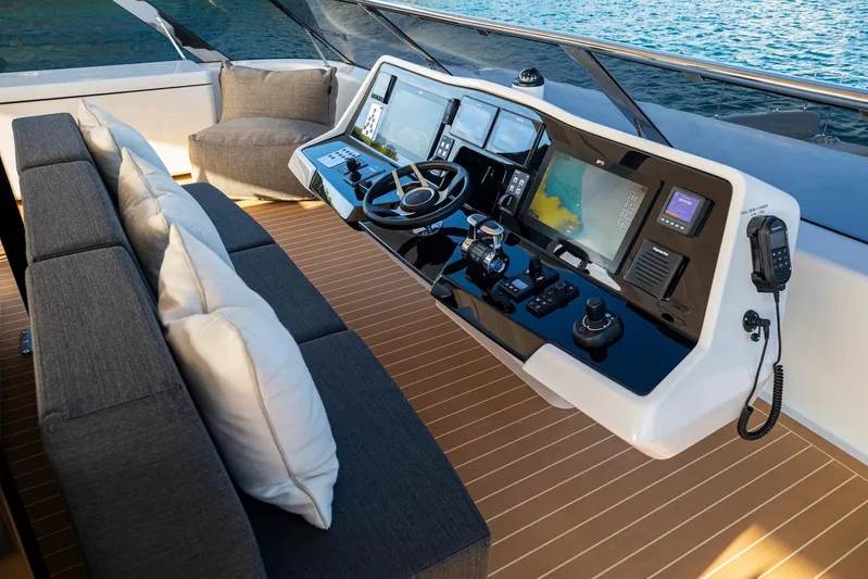 Vahewa Yacht Photos Pics 2024 Sunreef Power Cat helm with modern controls and plush seating on deck.