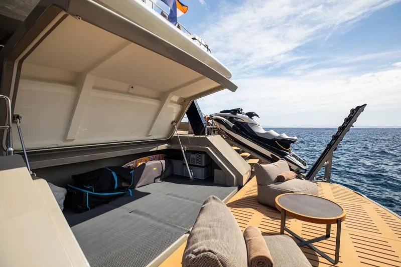 Vahewa Yacht Photos Pics 2024 Sunreef Power Cat yacht with open storage, jet ski, and ocean view.