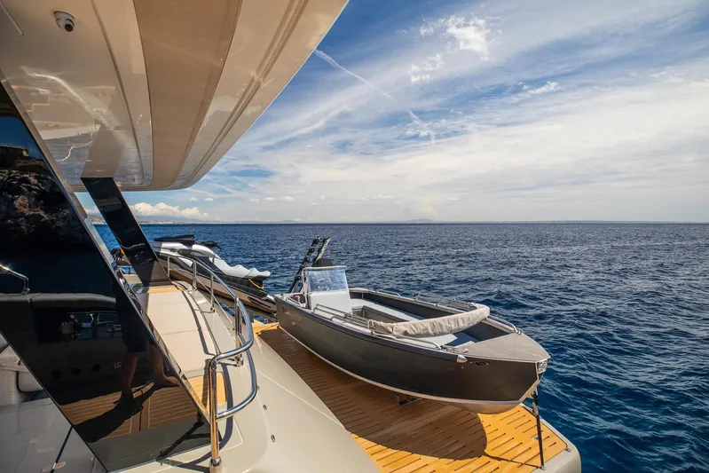 Vahewa Yacht Photos Pics 2024 Sunreef Power Cat yacht with tender on deck, overlooking serene ocean view.