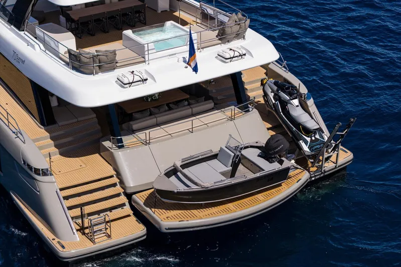 Vahewa Yacht Photos Pics Luxurious 2024 Sunreef Power Cat yacht with jet ski and tender on deck.