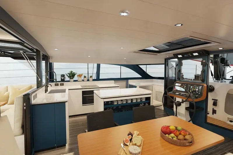 Hh56 Scf New Yacht Photos Pics Luxurious interior of 2026 HH Catamarans HH56, featuring modern kitchen and navigation area.