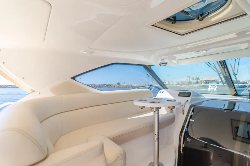 Niksen Yacht Photos Pics Interior of 2013 Tiara Yachts 3500 Sovran, featuring elegant seating and panoramic windows.