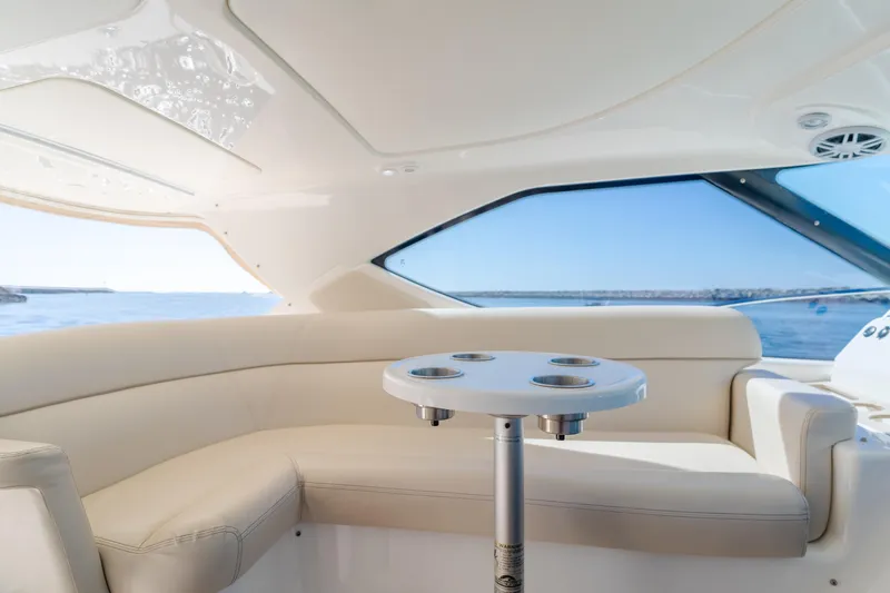 Niksen Yacht Photos Pics Luxurious interior of 2013 Tiara Yachts 3500 Sovran with elegant seating and ocean view.