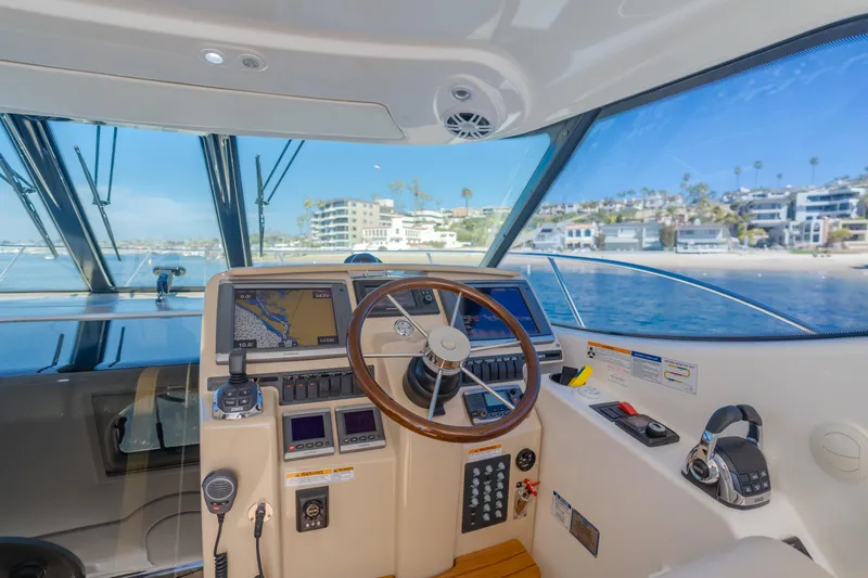 Niksen Yacht Photos Pics 2013 Tiara Yachts 3500 Sovran helm with ocean view and modern navigation equipment.