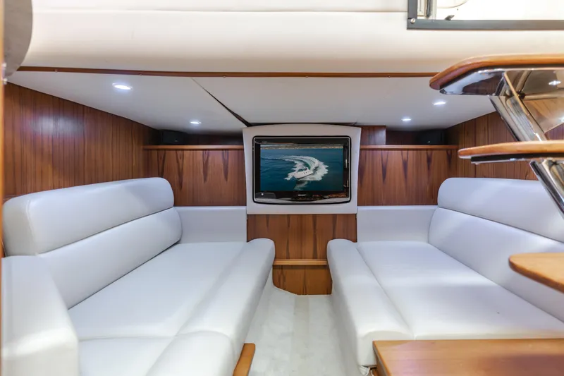 Niksen Yacht Photos Pics Luxurious interior of 2013 Tiara Yachts 3500 Sovran with plush seating and TV.