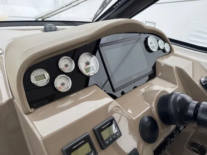 Bubbles Yacht Photos Pics 2016 Regal 35 Sport Coupe dashboard with gauges and touchscreen display.