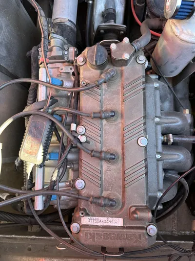 Scream Machine Yacht Photos Pics Engine of a 2016 Smoky Mountain 25 Passenger Jet Boat, showcasing intricate mechanical components.