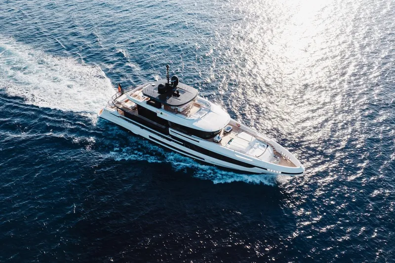 Half Irish Yacht Photos Pics 2024 Mangusta Oceano 44 yacht cruising on open sea, aerial view.