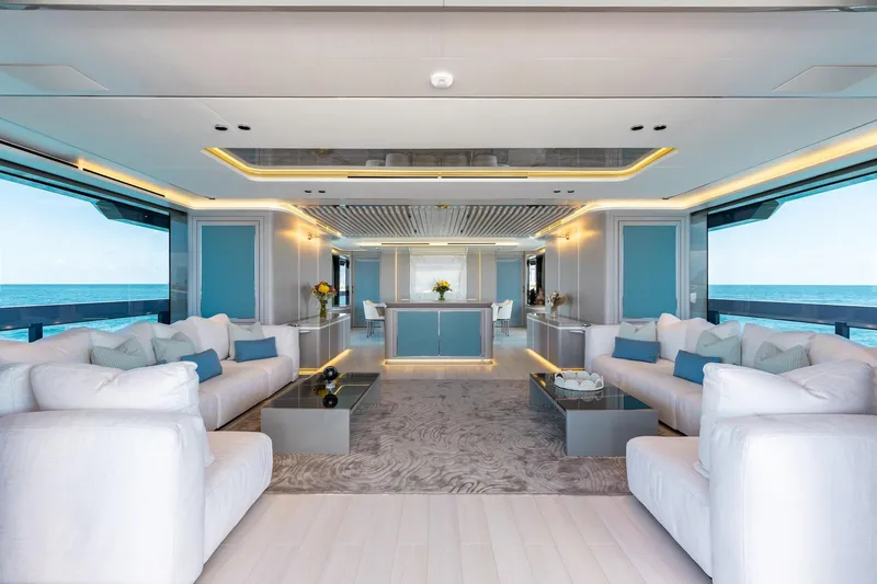 Half Irish Yacht Photos Pics Luxurious interior of 2024 Mangusta Oceano 44 yacht with elegant seating and ocean views.
