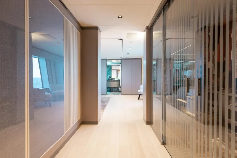 Half Irish Yacht Photos Pics Luxurious interior hallway of 2024 Mangusta Oceano 44 yacht, featuring modern design and elegant finishes.