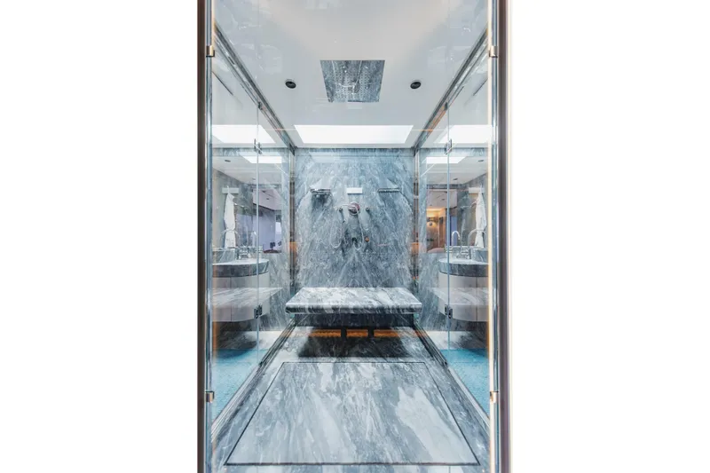 Half Irish Yacht Photos Pics Luxurious marble bathroom interior on 2024 Mangusta Oceano 44 yacht.
