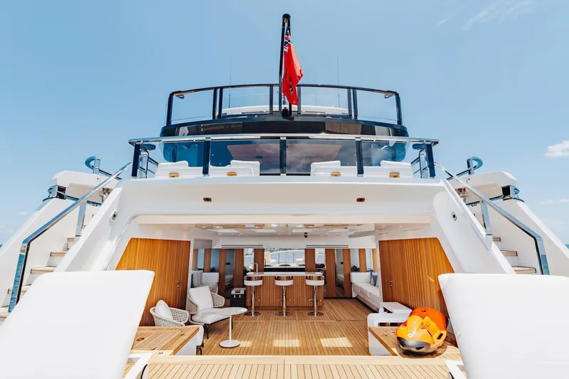 Half Irish Yacht Photos Pics Luxurious 2024 Mangusta Oceano 44 yacht deck with modern seating and sleek design.