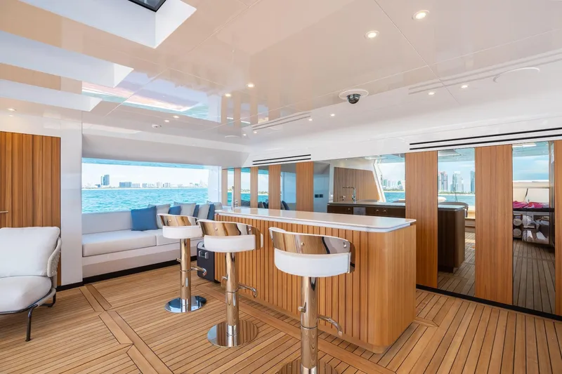 Half Irish Yacht Photos Pics Luxurious interior of 2024 Mangusta Oceano 44 yacht with modern bar and ocean view.