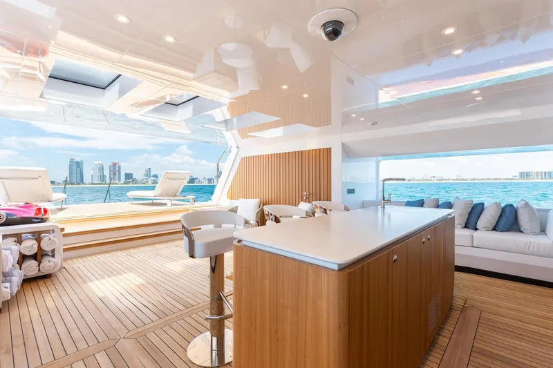Half Irish Yacht Photos Pics Luxurious interior of 2024 Mangusta Oceano 44 yacht with ocean view and modern amenities.