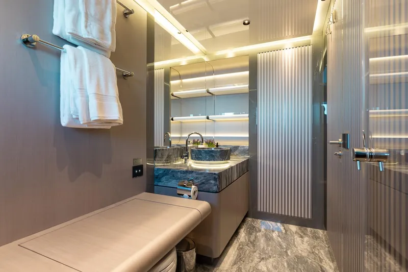 Half Irish Yacht Photos Pics Luxurious bathroom interior of 2024 Mangusta Oceano 44 yacht with modern fixtures and elegant design.