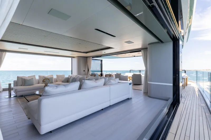 Half Irish Yacht Photos Pics Luxurious interior of 2024 Mangusta Oceano 44 yacht with ocean view and elegant seating.