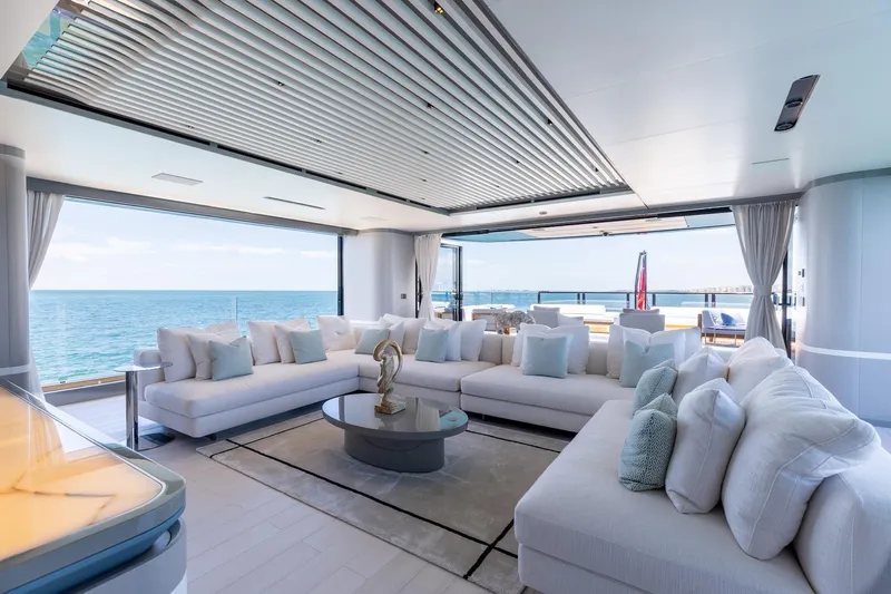 Half Irish Yacht Photos Pics Luxurious interior of 2024 Mangusta Oceano 44 yacht with ocean view and elegant seating.