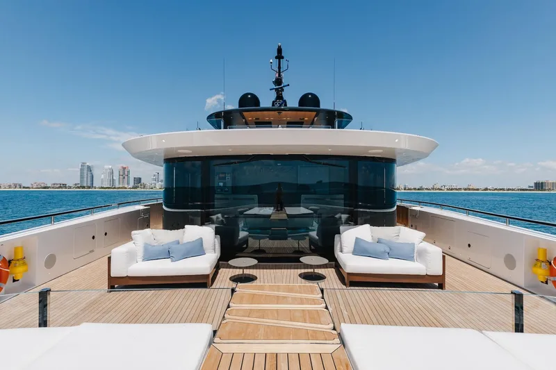 Half Irish Yacht Photos Pics Luxurious 2024 Mangusta Oceano 44 yacht deck with modern seating and ocean view.