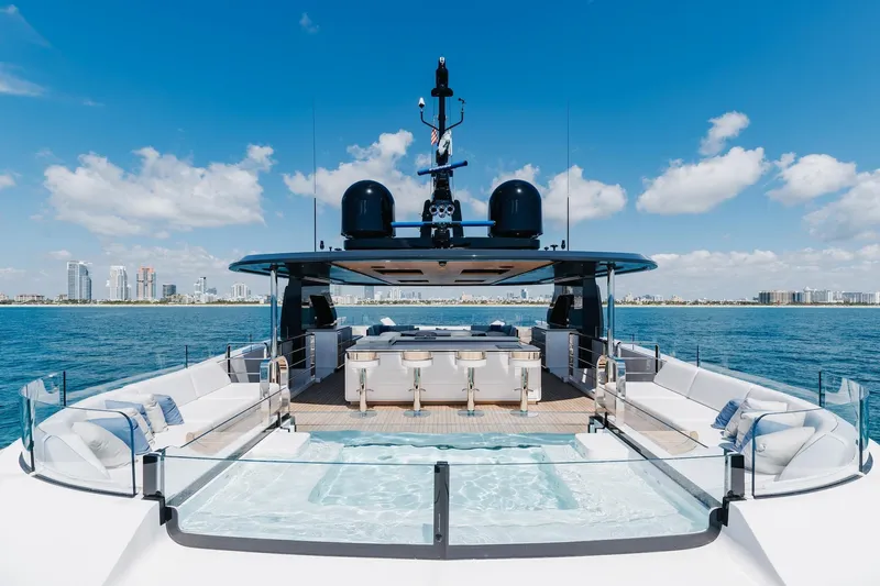 Half Irish Yacht Photos Pics Luxurious 2024 Mangusta Oceano 44 yacht with spacious deck and stunning ocean view.