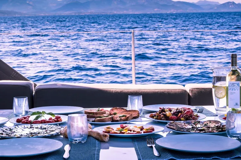 Ikigai Yacht Photos Pics Luxurious dining setup on JFA/Vitters 82 yacht with ocean view, 2002 model.