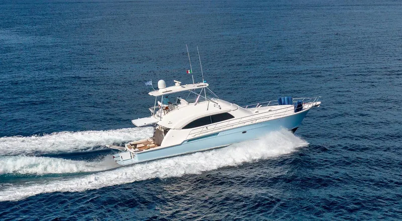  Yacht Photos Pics 2006 Bertram 570 yacht cruising on open sea, showcasing sleek design and powerful performance.