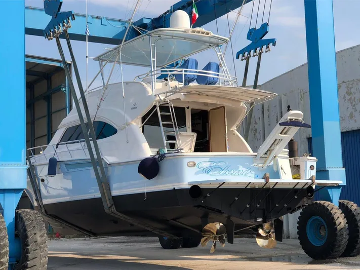  Yacht Photos Pics 2006 Bertram 570 yacht in dry dock, showcasing its sleek design and structure.