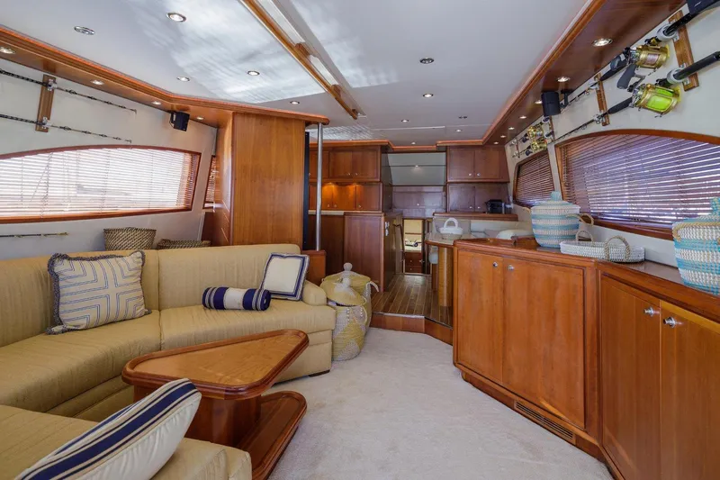  Yacht Photos Pics Luxurious interior of a 2006 Bertram 570 yacht with elegant wood finishes and comfortable seating.