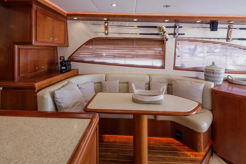  Yacht Photos Pics Luxurious 2006 Bertram 570 yacht interior with elegant seating and wooden accents.