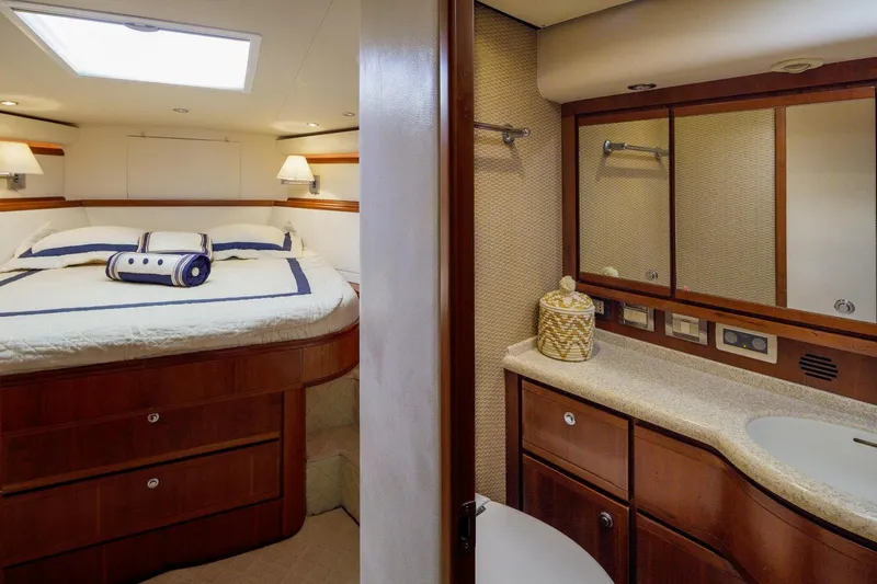  Yacht Photos Pics Luxurious 2006 Bertram 570 yacht interior with cozy bedroom and elegant bathroom.