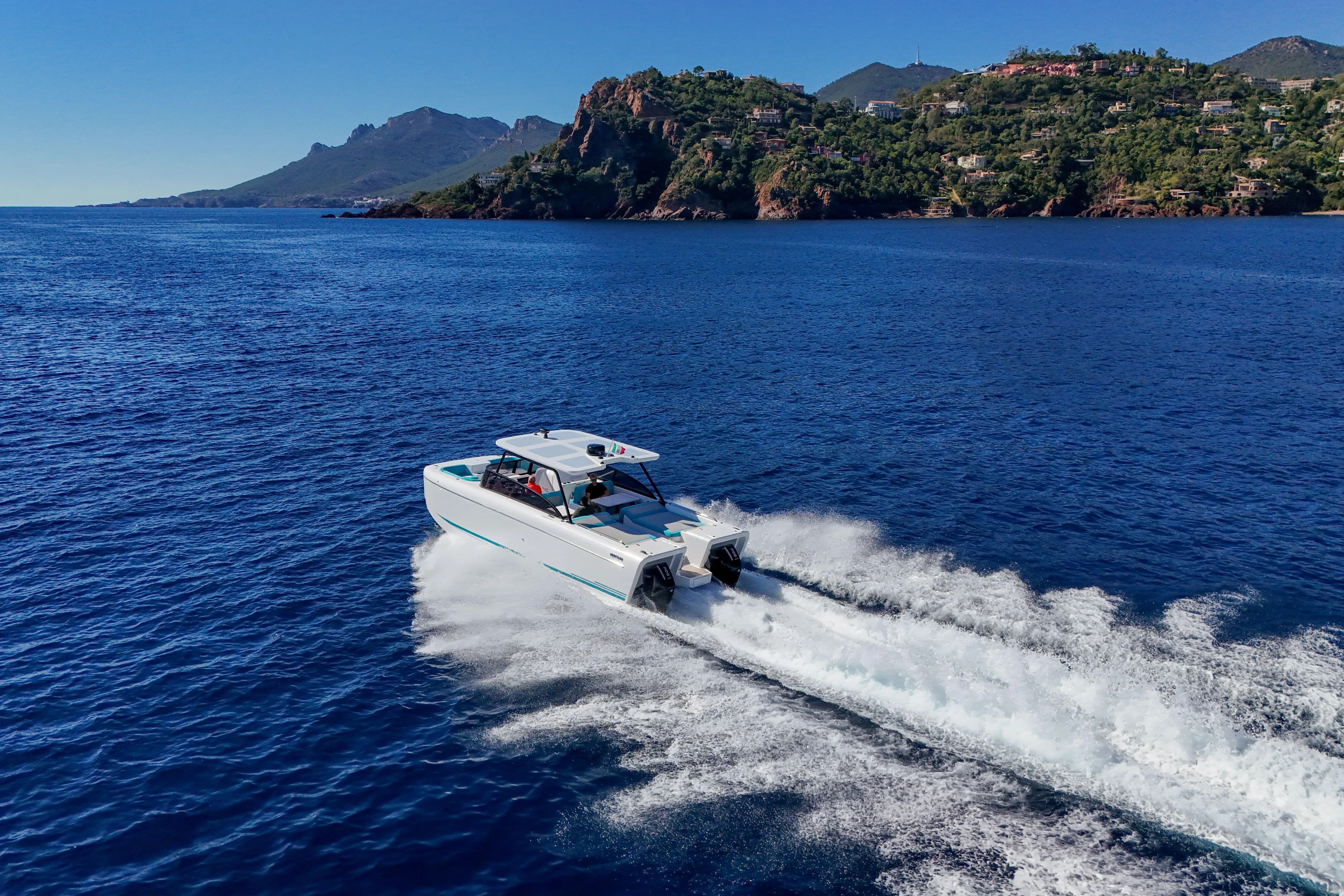  Yacht Photos Pics 2025 Canados Heritage 36 yacht cruising on blue ocean near scenic coastline.