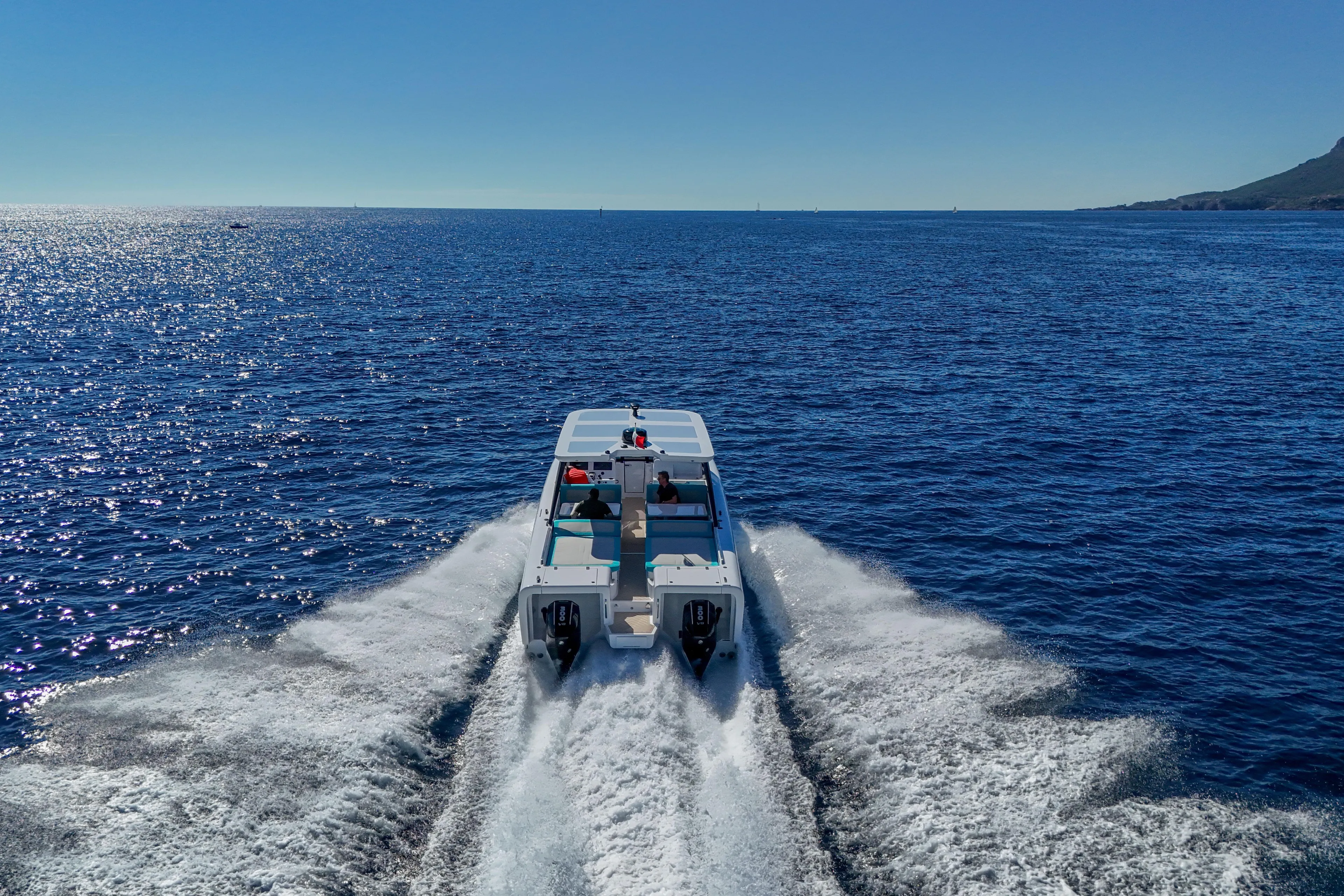  Yacht Photos Pics 2025 Canados Heritage 36 cruising on open sea under clear blue sky.