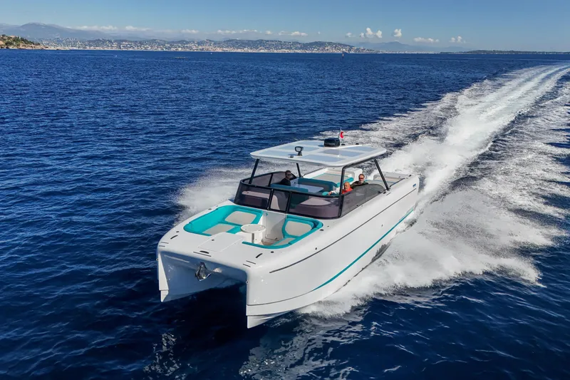  Yacht Photos Pics 2025 Canados Heritage 36 yacht cruising on open blue sea.