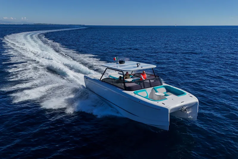  Yacht Photos Pics 2025 Canados Heritage 36 yacht cruising on open blue sea.