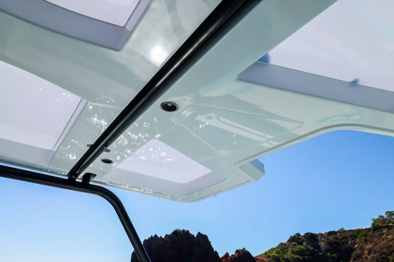  Yacht Photos Pics Rooftop view of 2025 Canados Heritage 36 yacht against clear blue sky.