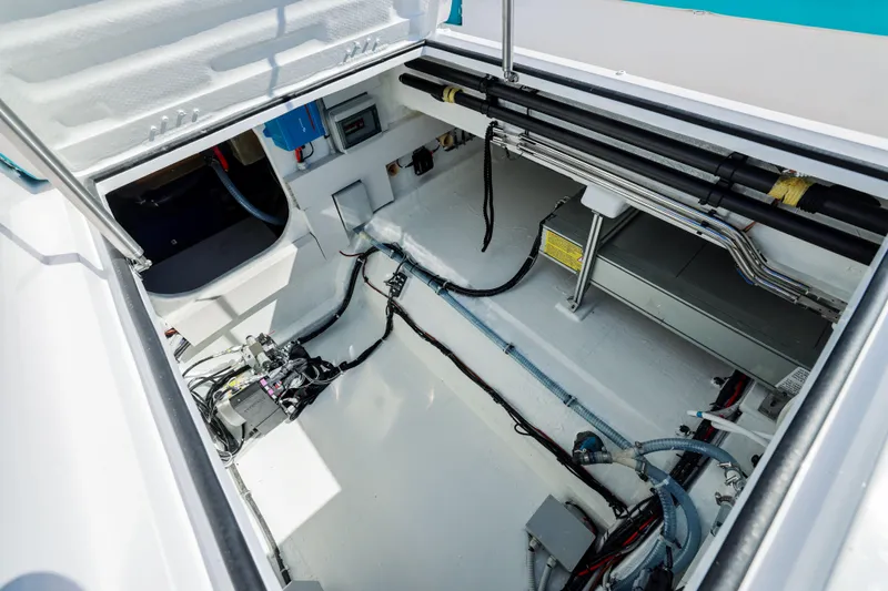  Yacht Photos Pics Engine compartment of 2025 Canados Heritage 36 yacht, showcasing wiring and mechanical components.