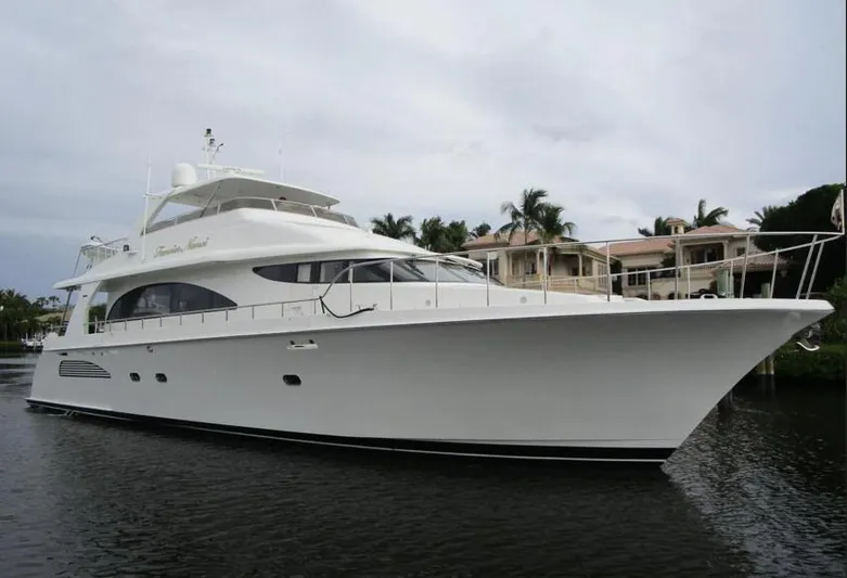 Fancier Nanci Yacht Photos Pics 2002 Cheoy Lee Sport Motor Yacht docked near waterfront homes.