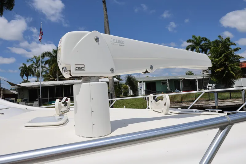  Yacht Photos Pics 2012 Bertram 511 yacht with a mounted crane against a clear sky.