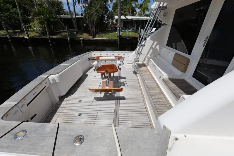  Yacht Photos Pics Bertram 511 yacht deck, 2012 model, featuring wooden flooring and seating area.