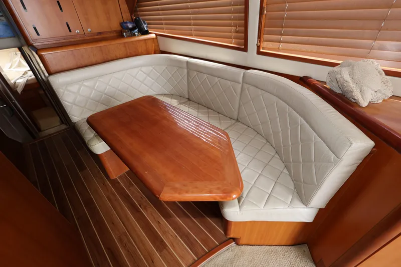  Yacht Photos Pics Luxurious interior of 2012 Bertram 511 yacht with elegant wood and leather seating.