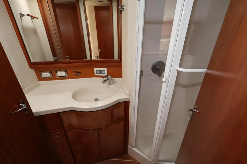  Yacht Photos Pics Bathroom interior of 2012 Bertram 511 yacht with sink and shower.